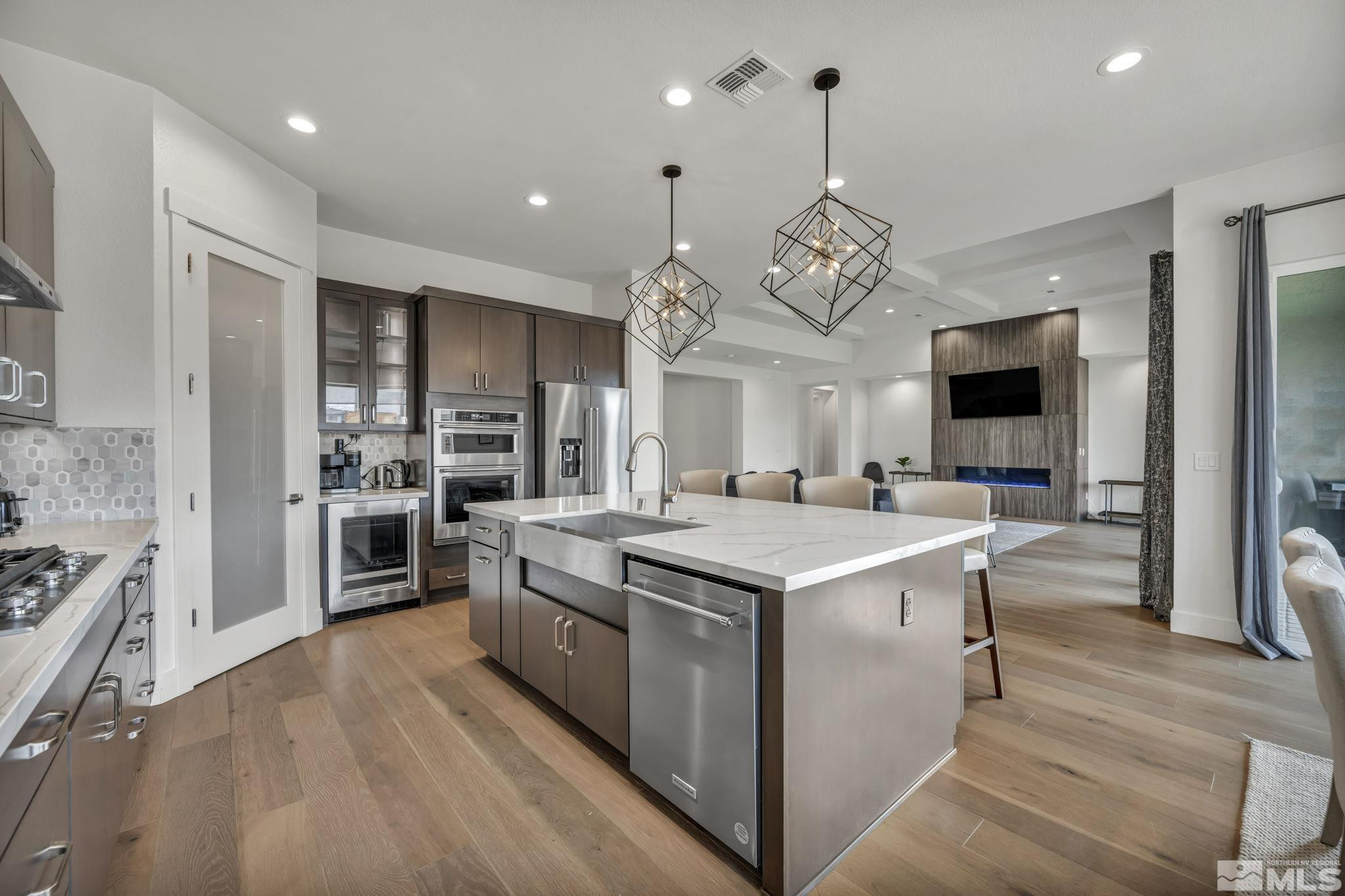 9525 Copper Sky Drive Reno, NV 89521 - Photo 12 of 40 a kitchen with stove and refrigerator