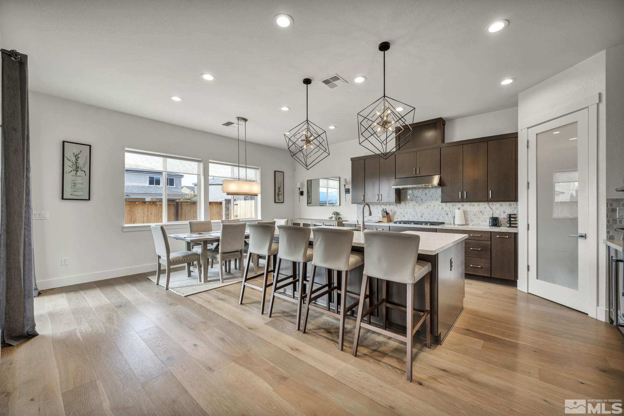 9525 Copper Sky Drive Reno, NV 89521 - Photo 17 of 40 a large kitchen with a table and chairs
