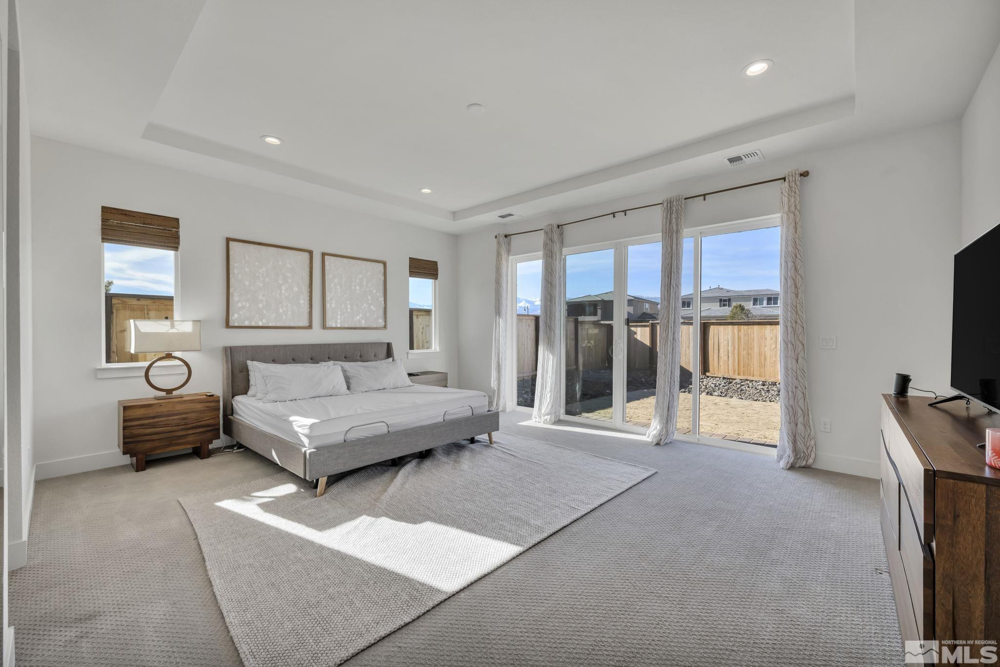 9525 Copper Sky Drive Reno, NV 89521 - Photo 20 of 40 a living room with furniture and a flat screen tv