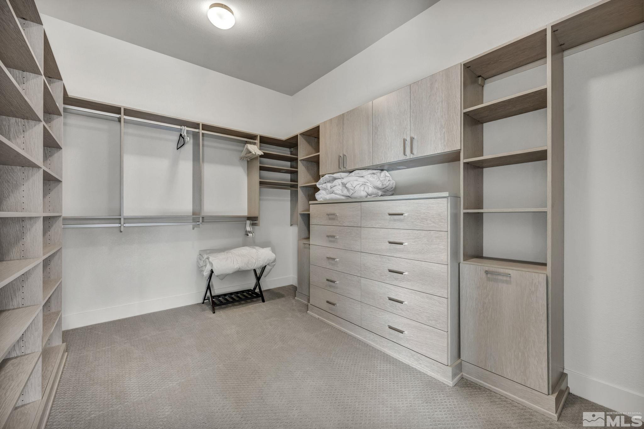 9525 Copper Sky Drive Reno, NV 89521 - Photo 24 of 40 a bedroom with a bed and a walk in closet