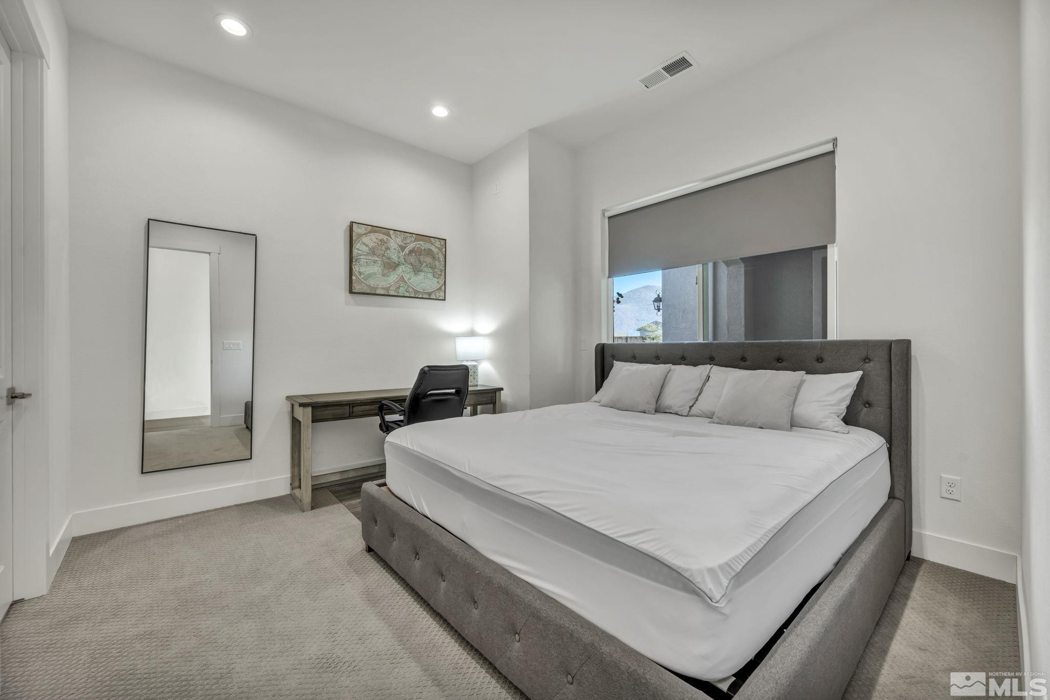 9525 Copper Sky Drive Reno, NV 89521 - Photo 26 of 40 a large white bed in a white room