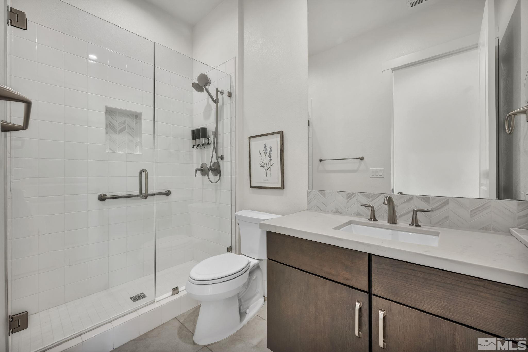 9525 Copper Sky Drive Reno, NV 89521 - Photo 27 of 40 a bathroom with a sink toilet and shower