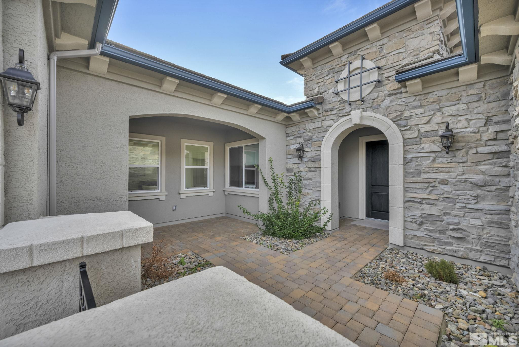 9525 Copper Sky Drive Reno, NV 89521 - Photo 3 of 40 a front view of a house with garden