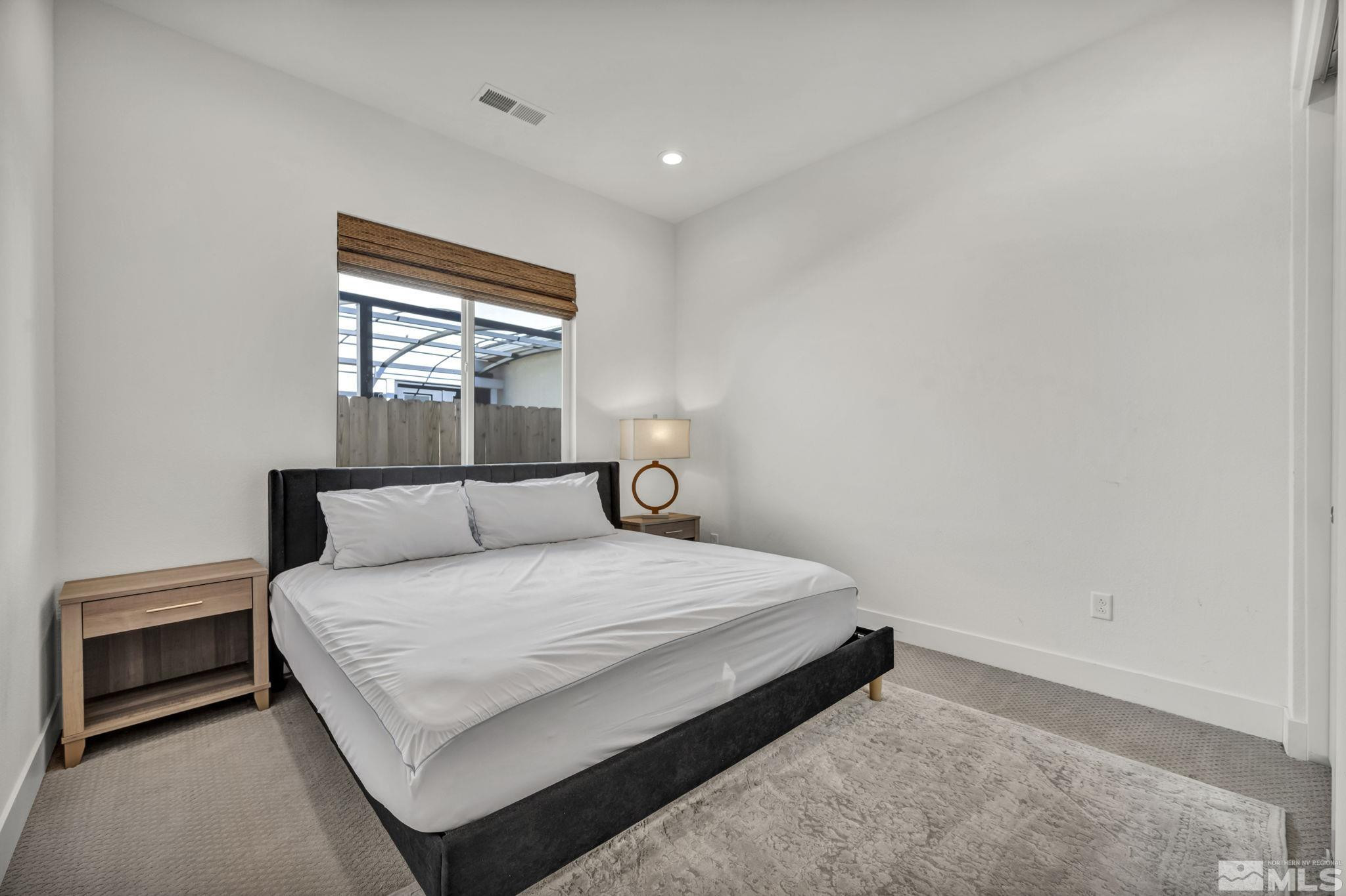 9525 Copper Sky Drive Reno, NV 89521 - Photo 31 of 40 a bedroom with a bed and window