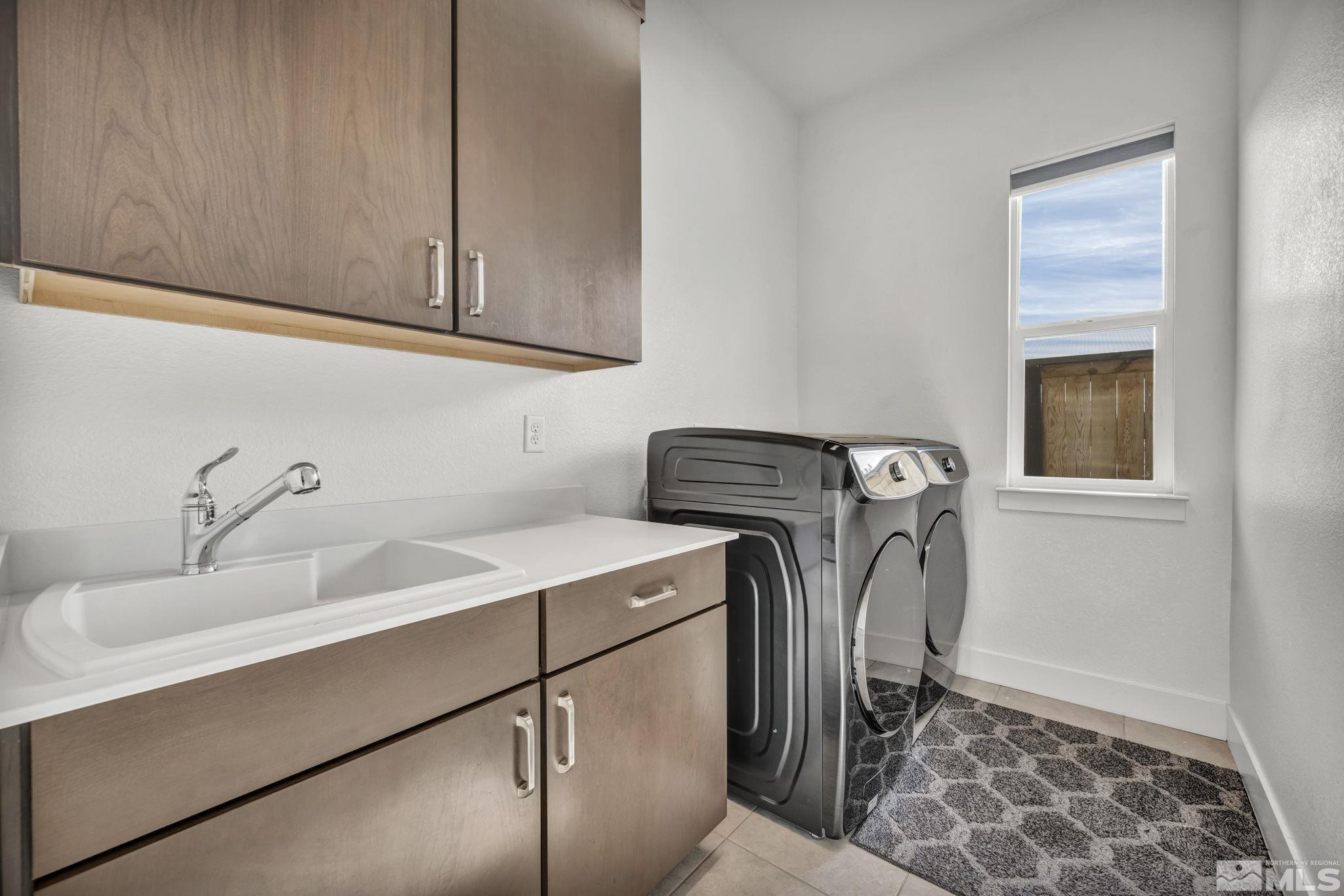 9525 Copper Sky Drive Reno, NV 89521 - Photo 33 of 40 a utility room with dryer and washer