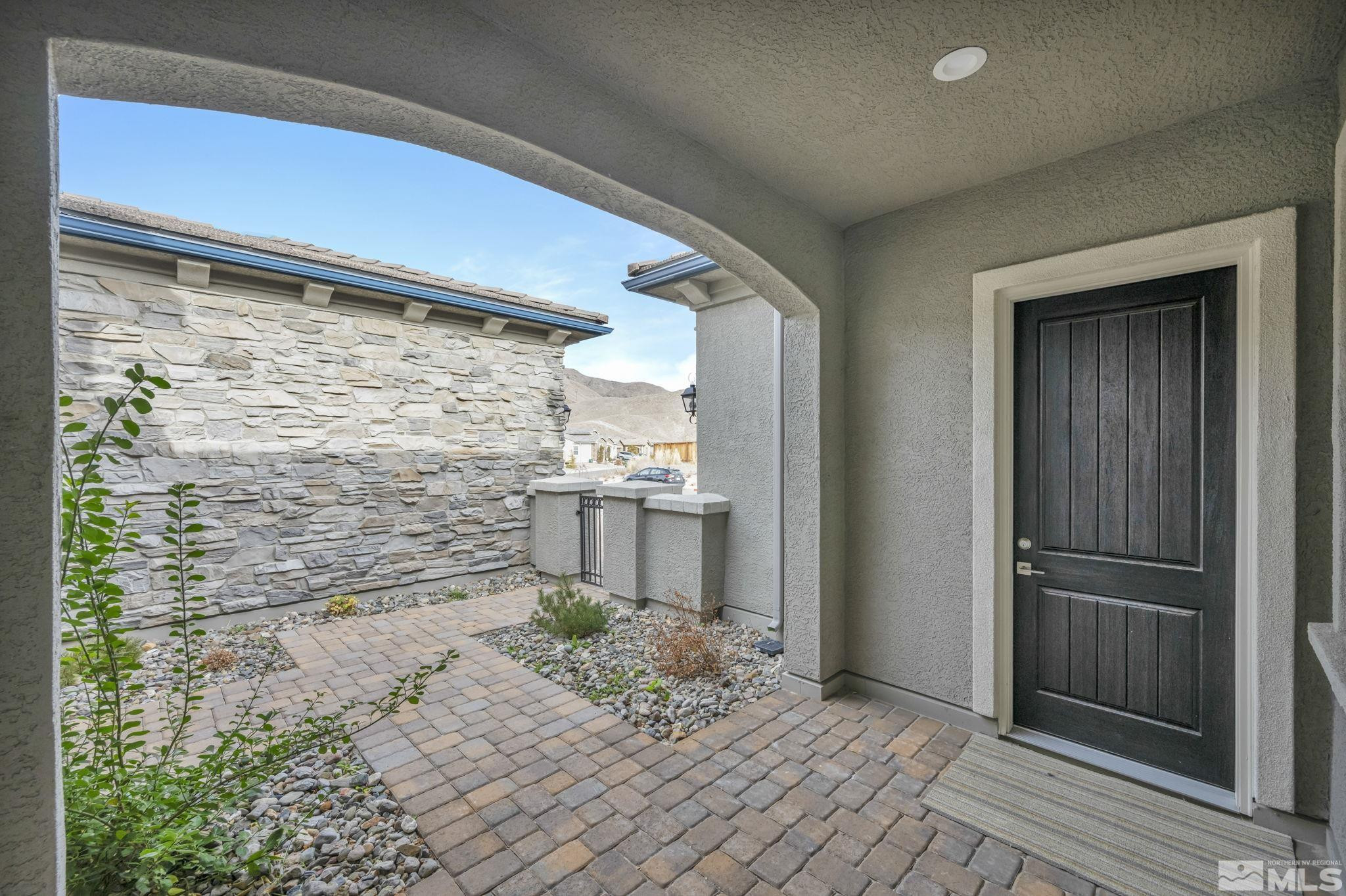 9525 Copper Sky Drive Reno, NV 89521 - Photo 4 of 40 a view of a door and wooden floor