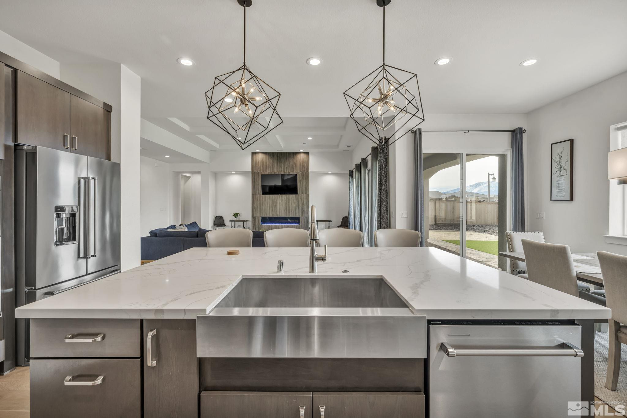 9525 Copper Sky Drive Reno, NV 89521 - Photo 10 of 40 a large kitchen with a table and chairs