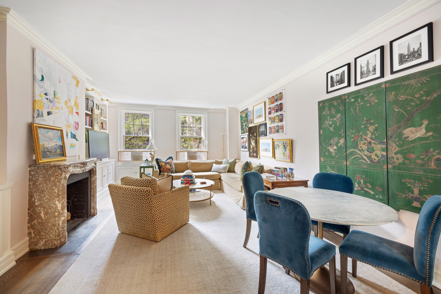 125 East 74th Street, Unit 4A Manhattan, NY 10021 - Photo 3 of 10 a living room with fireplace furniture and a floor to ceiling window