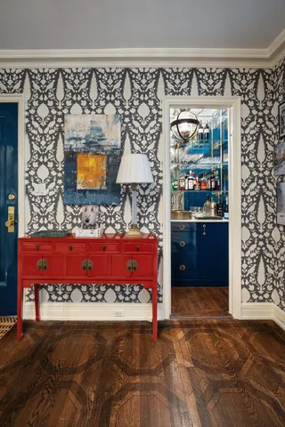 a living room with fireplace furniture and a floor to ceiling window