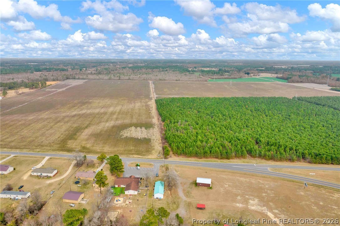 0 Paddock Meadows Red Springs, NC 28377 - Photo 13 of 26 a view of a lake with a big yard