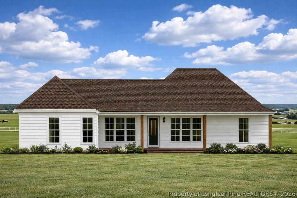 0 Paddock Meadows Red Springs, NC 28377 - Photo 23 of 26 a front view of a house with a garden