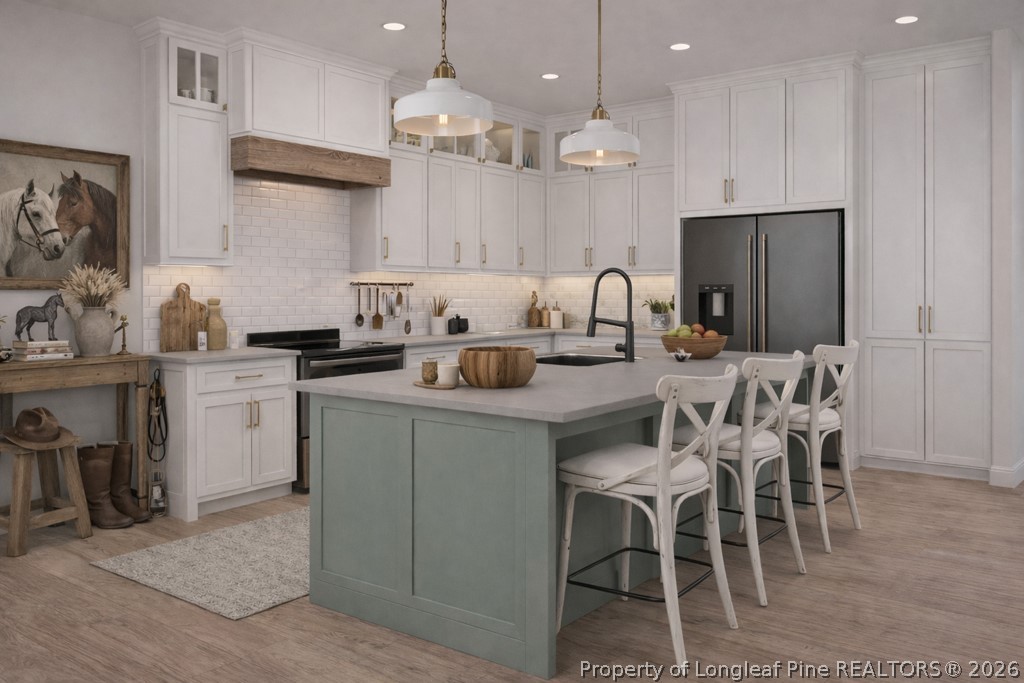 0 Paddock Meadows Red Springs, NC 28377 - Photo 5 of 26 a kitchen with a dining table cabinets and stainless steel appliances