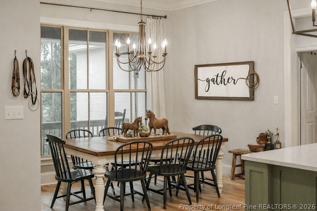 0 Paddock Meadows Red Springs, NC 28377 - Photo 6 of 26 a view of a dining room with furniture and chandelier