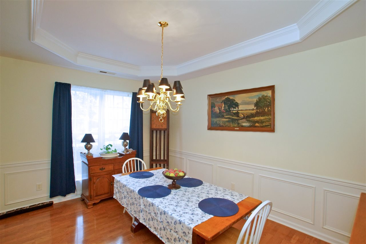 7540 Silver View Lane Raleigh, NC 27613 - Photo 6 of 29 Formal dining room with trey ceiling and hardwood flooring. Dining Room