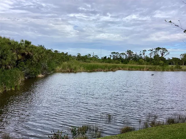 a view of a lake with a terrace patio