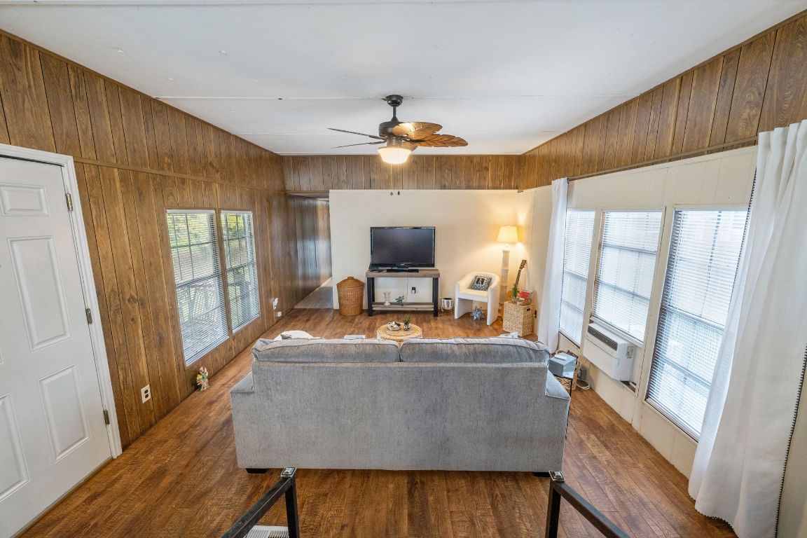 5811 Nancy Drive Austin, TX 78745 - Photo 13 of 26 a living room with furniture and a flat screen tv