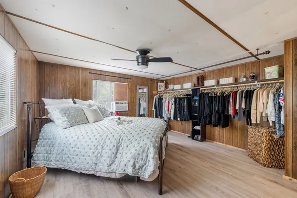 a bed room with a bed and a walk in closet