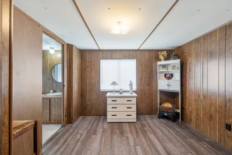 a room with a bed and furniture