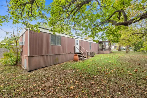 a view of a backyard of the house