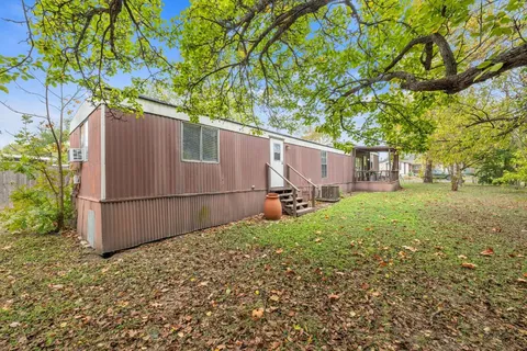 a view of a backyard of the house