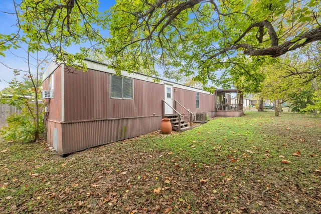 a view of a backyard of the house