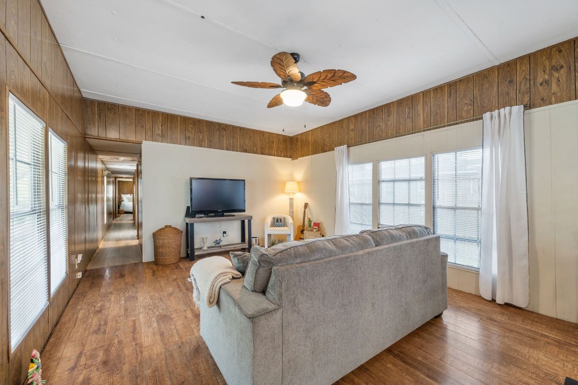 5811 Nancy Drive Austin, TX 78745 - Photo 6 of 26 a living room with furniture and a flat screen tv