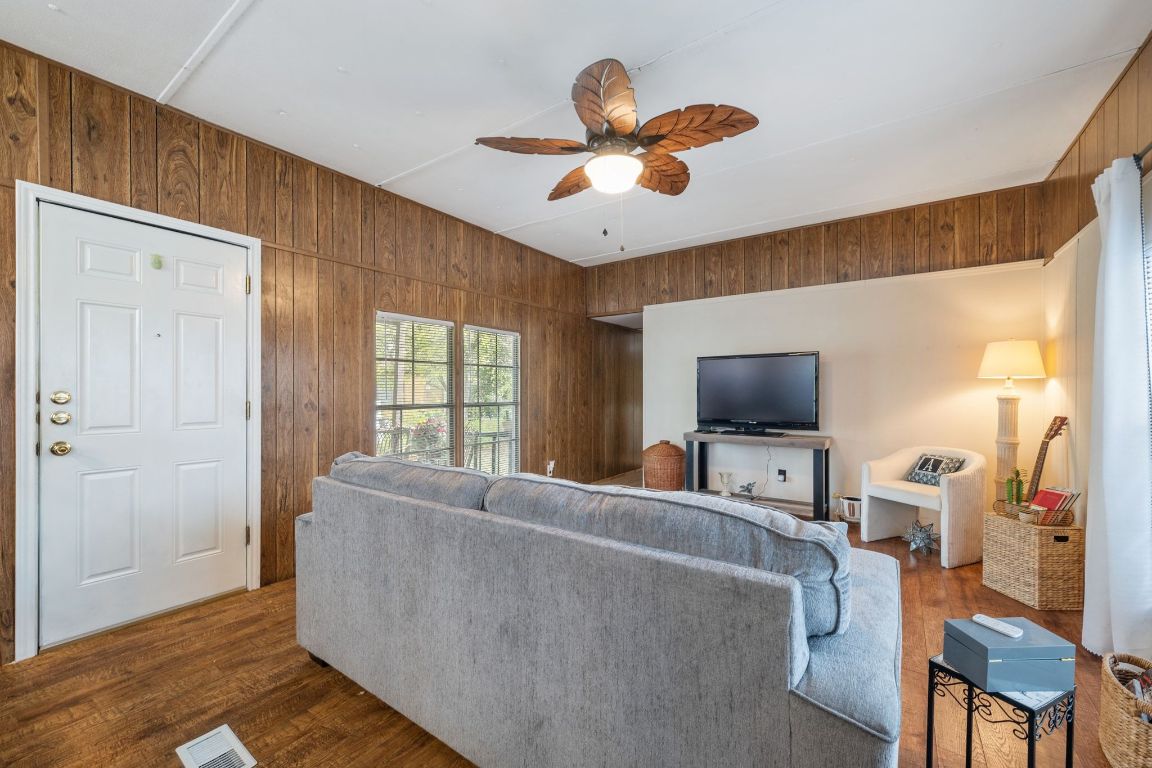 5811 Nancy Drive Austin, TX 78745 - Photo 8 of 26 a living room with furniture and a flat screen tv