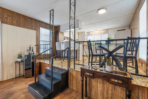 a large white kitchen with a large window