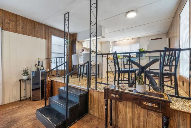 a large white kitchen with a large window