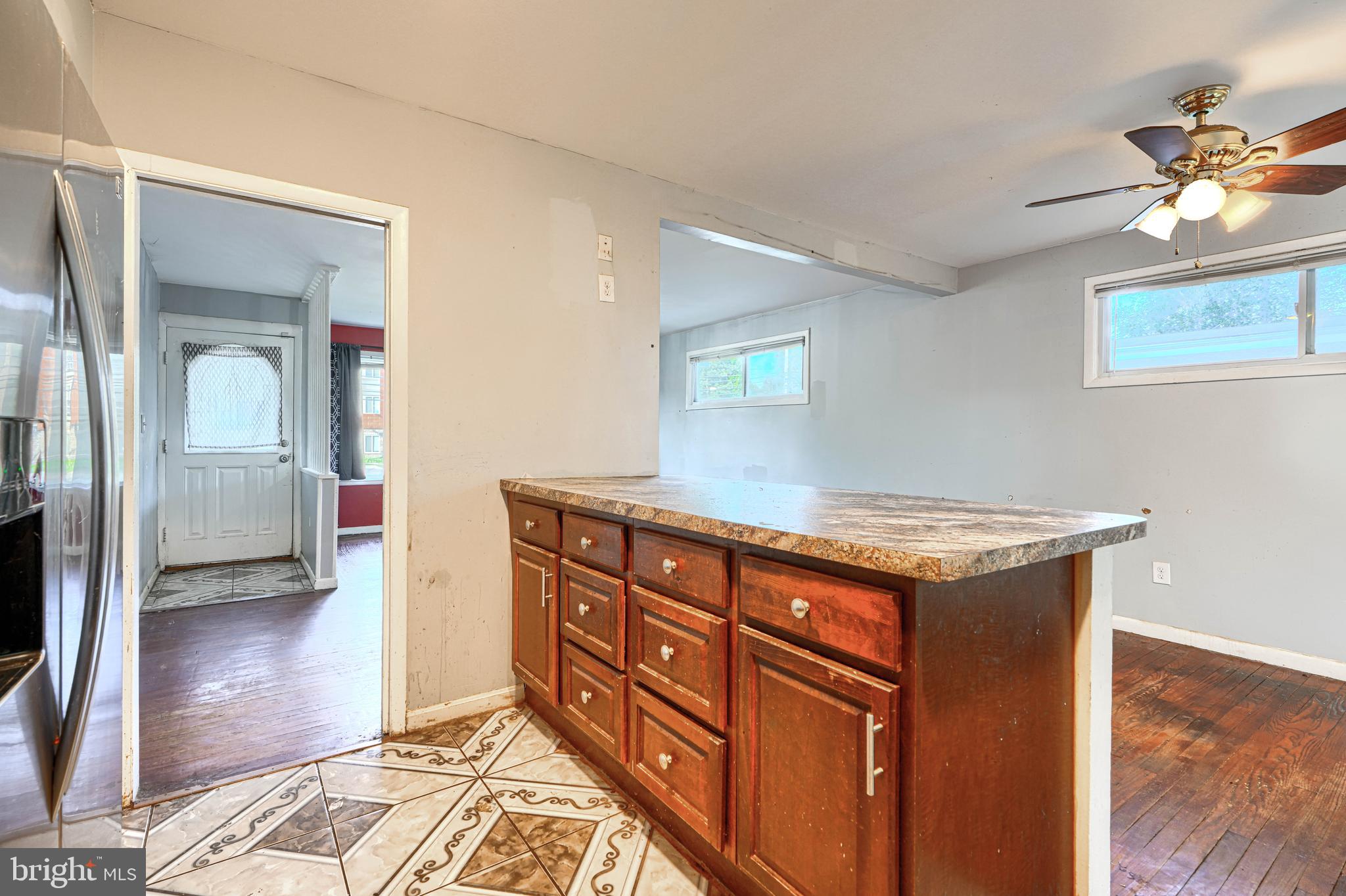 9706 Liberty Road Randallstown, MD 21133 - Photo 21 of 43 a kitchen with stainless steel appliances granite countertop a stove a sink and a refrigerator