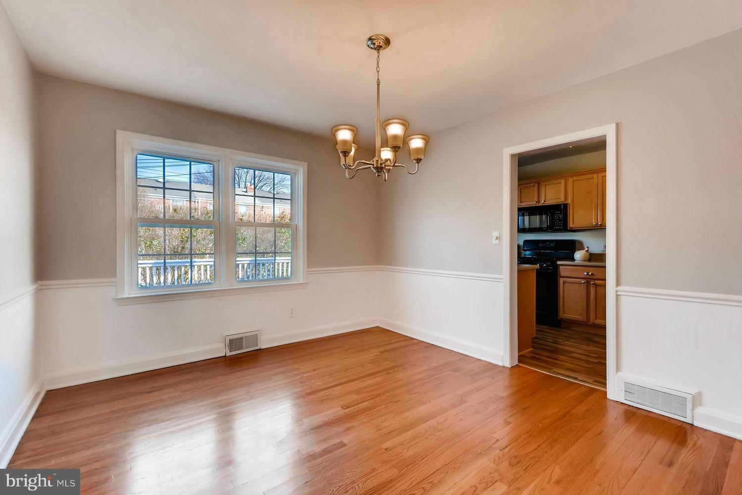 1612 Feldbrook Road Towson, MD 21286 - Photo 9 of 30 LARGE DINING ROOM WITH CHAIR RAIL OVERLOOKS DECK