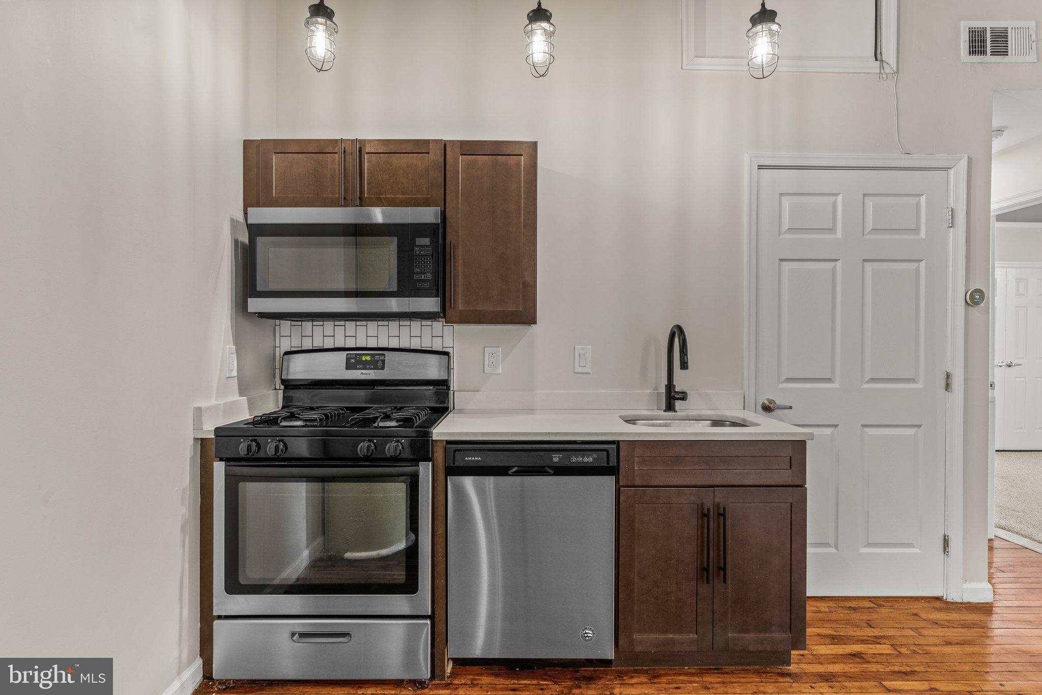 1217-35 Spring Garden Street, Unit 304 Philadelphia, PA 19123 - Photo 12 of 24 Open Concept Kitchen + Dining