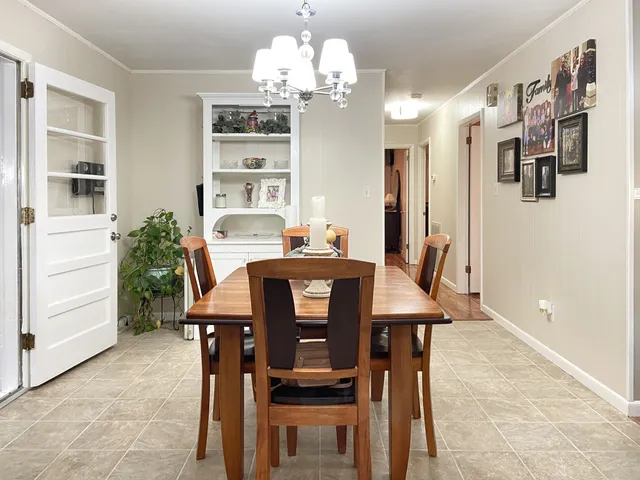a dining room with furniture and window