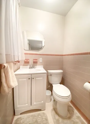 a bedroom with furniture and a flat screen tv