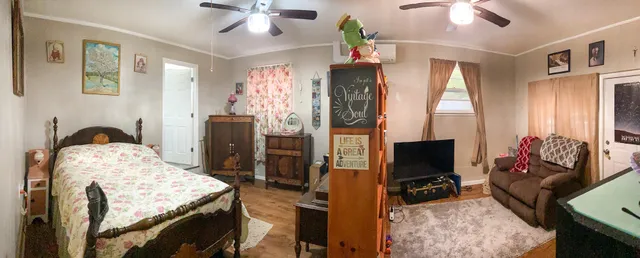 a bedroom with a bed and a fireplace