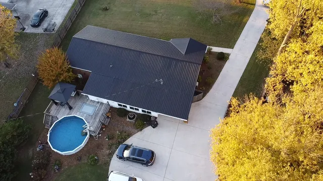 a view of a small house with a small yard