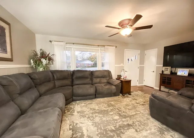 a living room with furniture and a rug