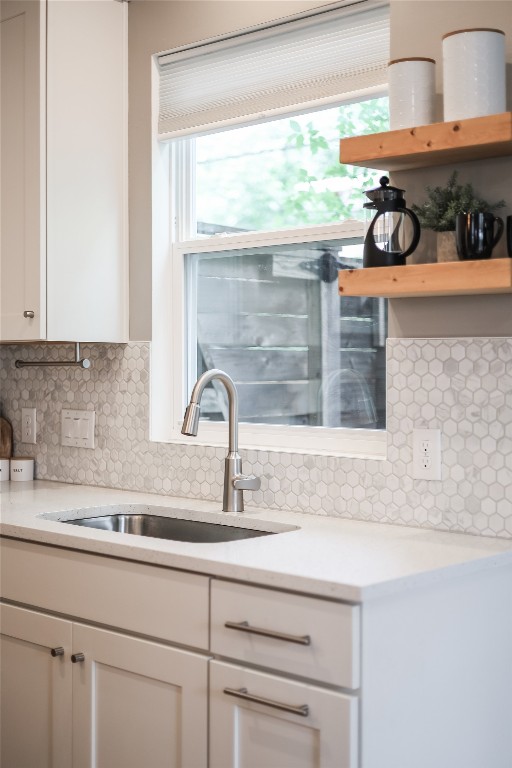 5512 Duval Street, Unit 2 Austin, TX 78751 - Photo 19 of 39 a kitchen with granite countertop a sink and a window