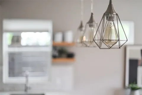 a view of an entryway with wooden floor and a workspace