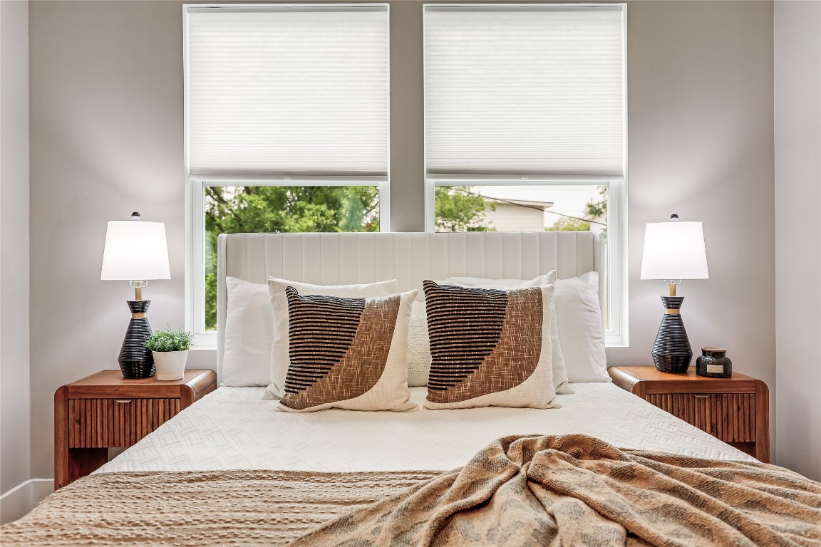 5512 Duval Street, Unit 2 Austin, TX 78751 - Photo 25 of 39 a bed sitting in a bedroom next to a window