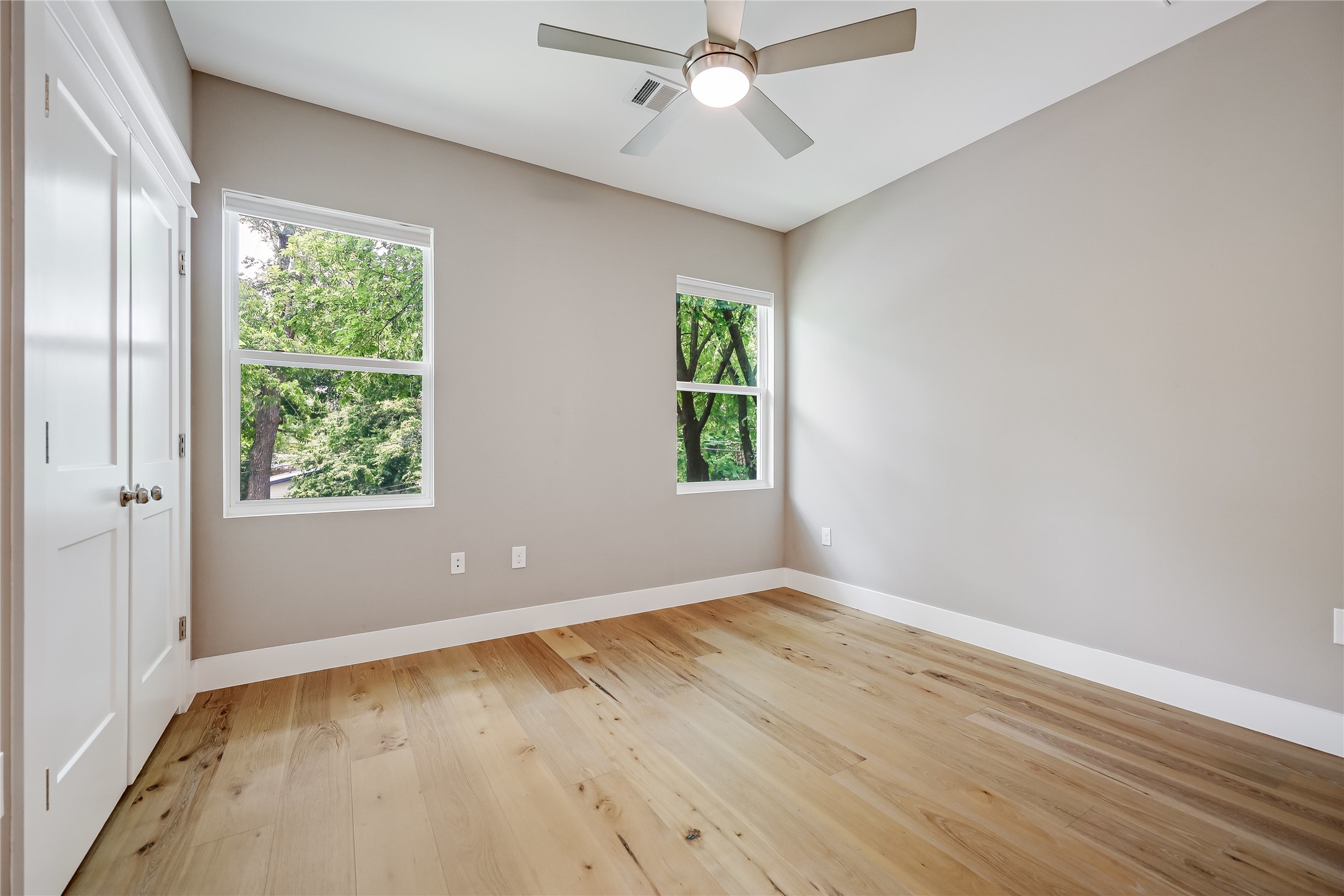 5512 Duval Street, Unit 2 Austin, TX 78751 - Photo 30 of 39 wooden floor in an empty room with a window