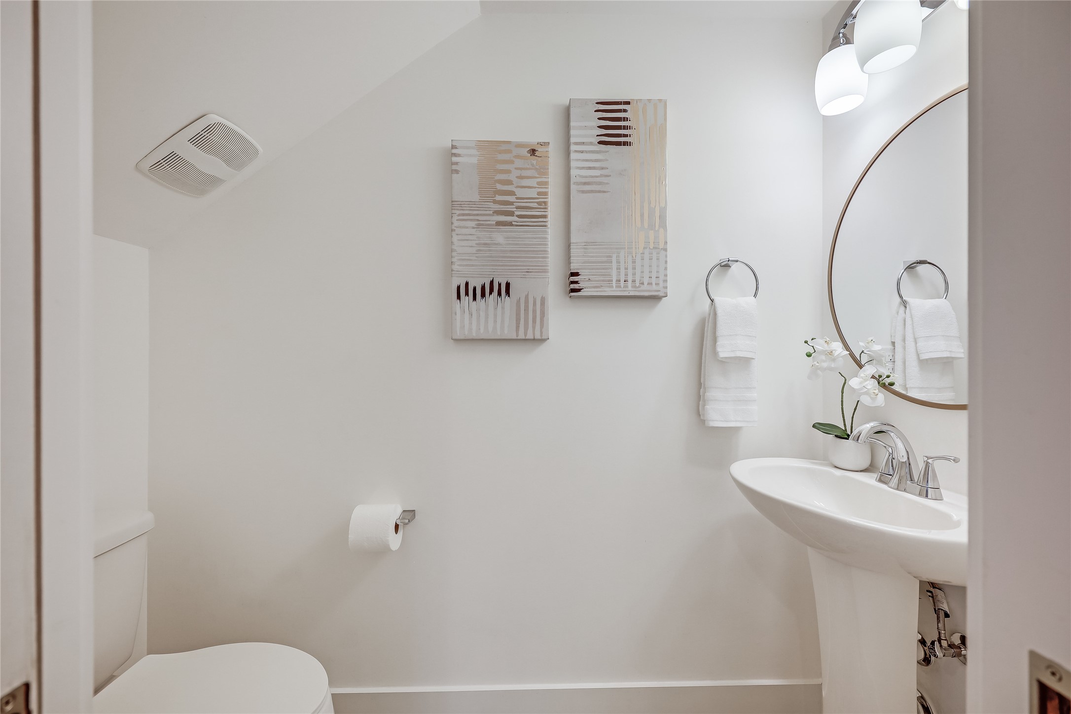 5512 Duval Street, Unit 2 Austin, TX 78751 - Photo 33 of 39 a bathroom with a sink a toilet and a mirror