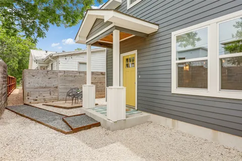 a view of a pathway of a house with a porch