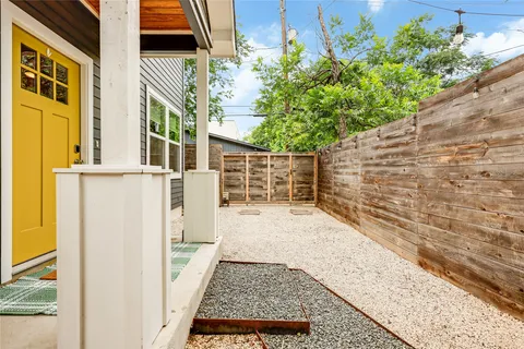 a view of a pathway both side of house