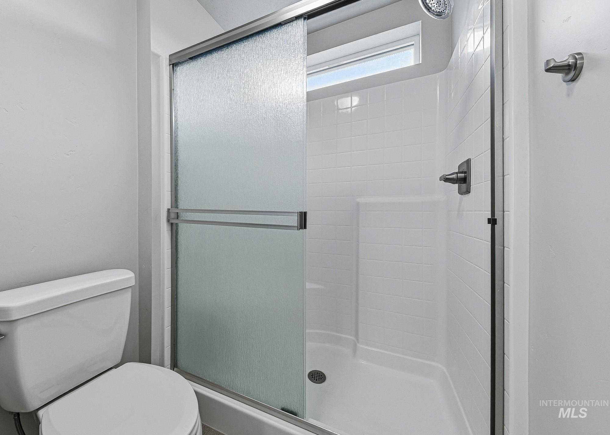 3065 North Summerbrook Avenue Meridian, ID 83646 - Photo 20 of 33 Full bathroom with a stall shower and toilet