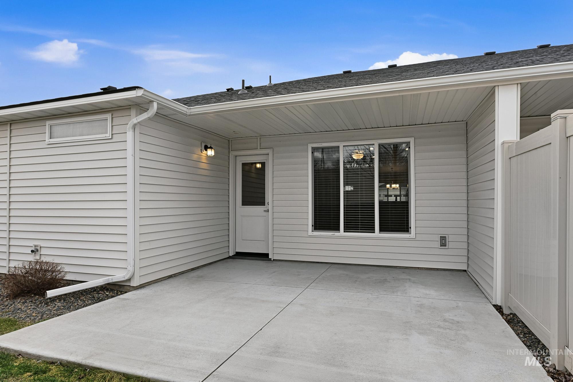 3065 North Summerbrook Avenue Meridian, ID 83646 - Photo 30 of 33 Entrance to property featuring a patio area and a shingled roof