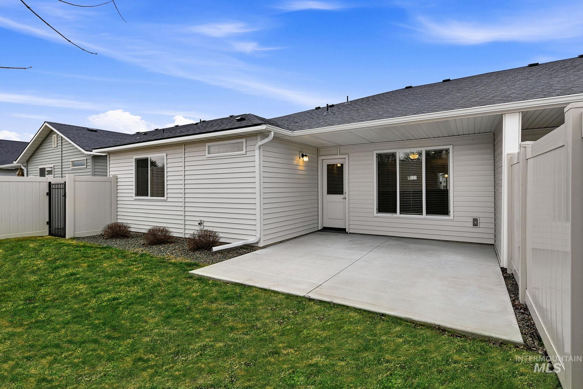 3065 North Summerbrook Avenue Meridian, ID 83646 - Photo 31 of 33 Back of property featuring a gate, a patio area, and a shingled roof