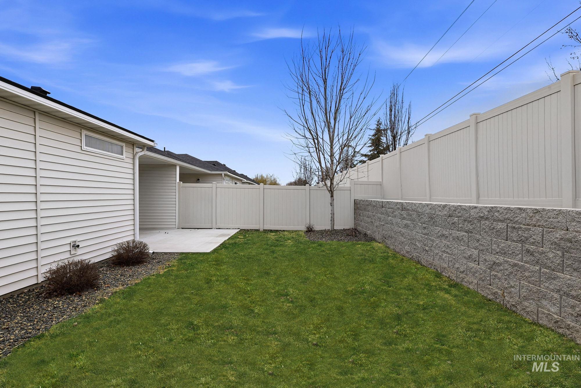 3065 North Summerbrook Avenue Meridian, ID 83646 - Photo 32 of 33 Fenced backyard with a patio area