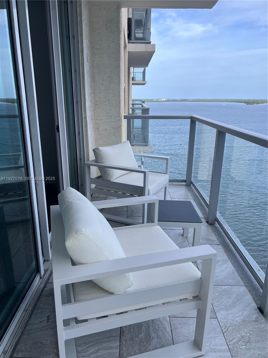 1155 Brickell Bay Drive, Unit 1607 Miami, FL 33131 - Photo 8 of 9 a view of entryway and hall with wooden floor