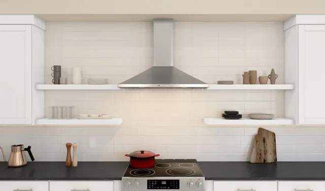 a kitchen with stainless steel appliances kitchen island granite countertop a sink a stove a dining table and chairs